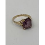 9ct gold ring set with a purple stone