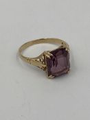 9ct gold ring set with a purple stone