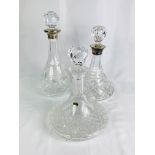 Two cut glass decanters with silver collars together with a cut glass ships decanter