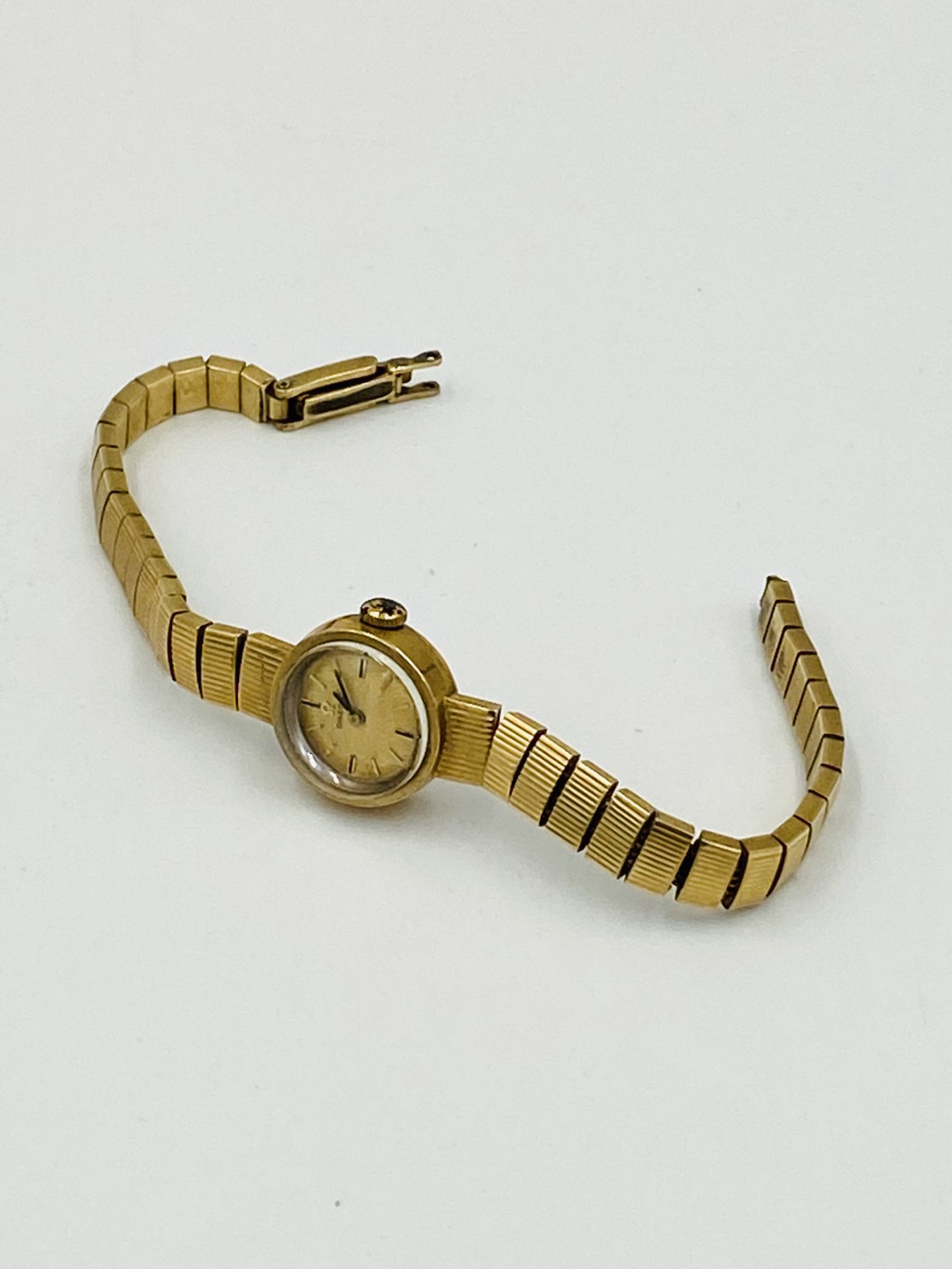 Ladies cocktail watch on 9ct gold strap