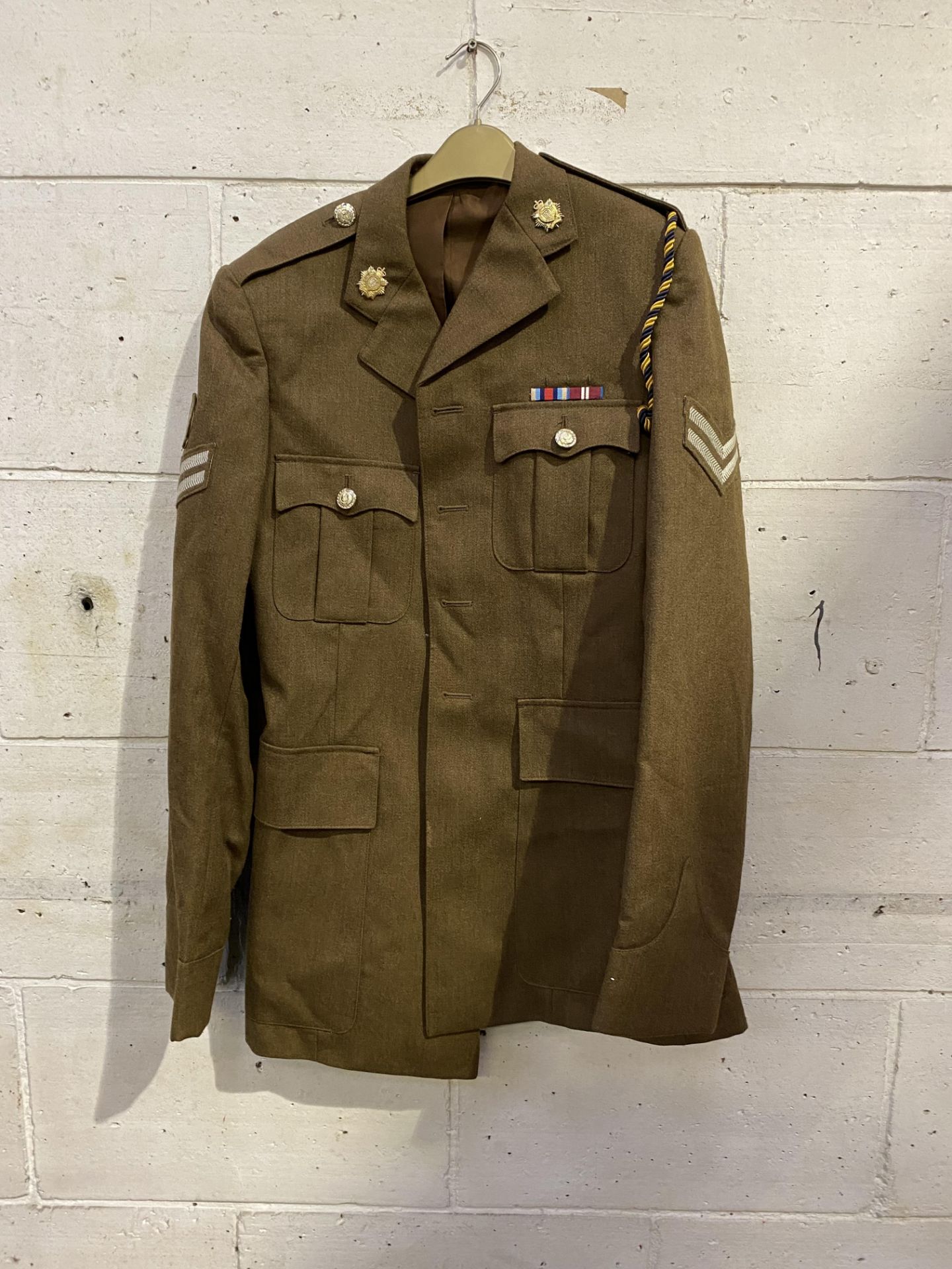 Army dress jacket together with a sailor's dress jacket and cap