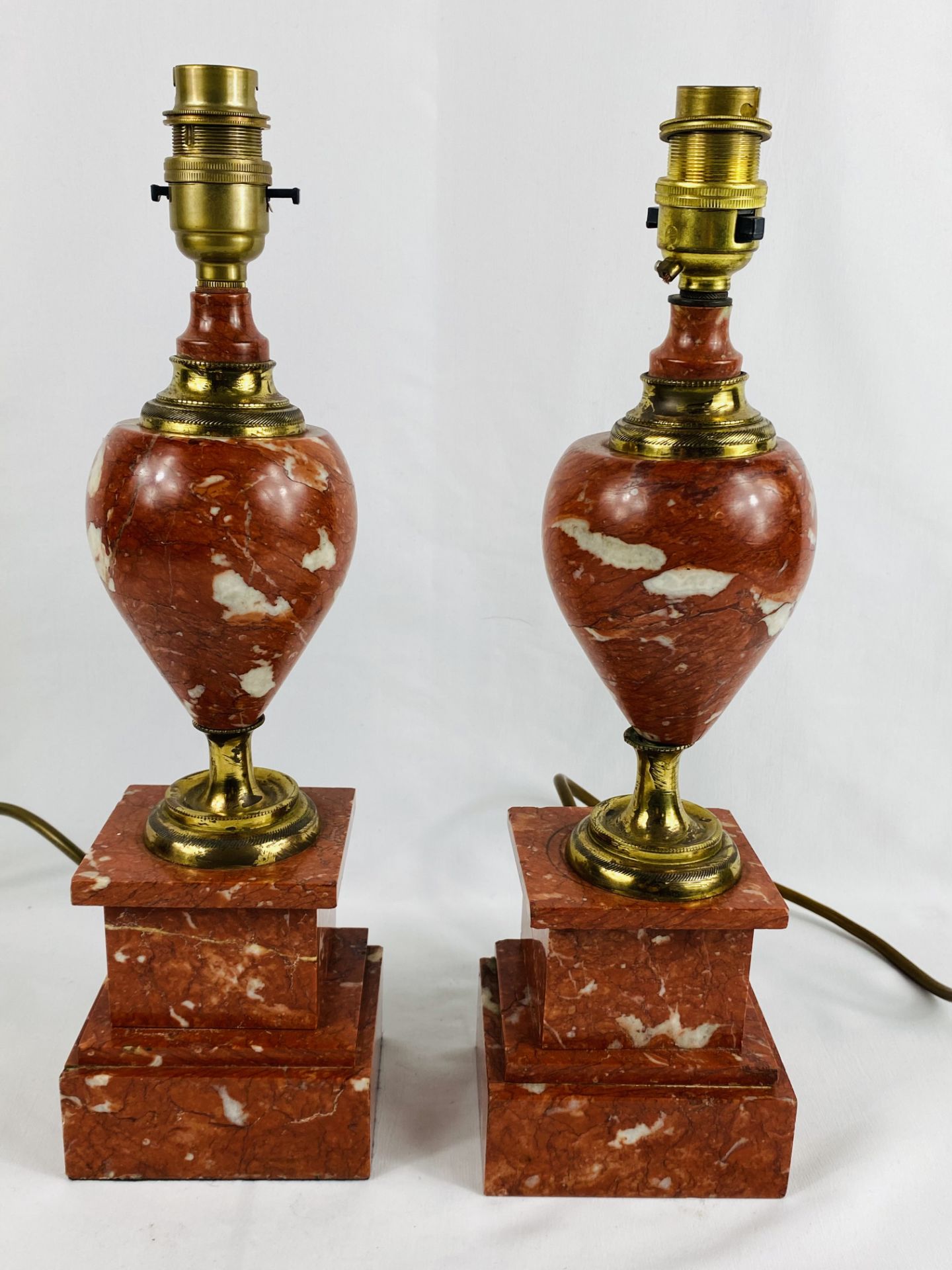 Pair of red marble table lamps