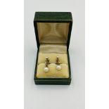 Pair of 9ct gold earrings with pearl drops