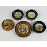 Five wood framed ceramic pot lids