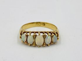 18ct gold ring set with five opals