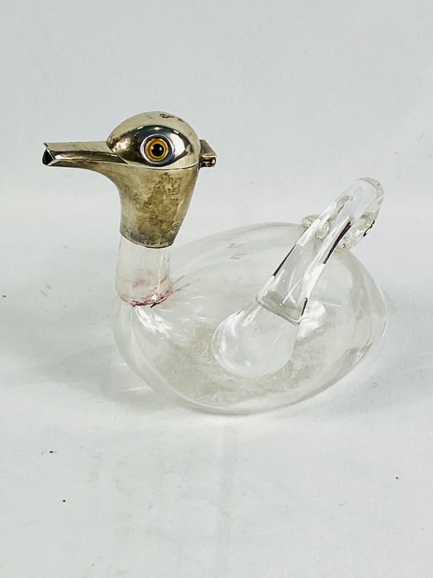 Oil decanter styled as a duck with silver head and spout