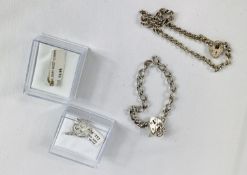 Two silver bracelets together with a quantity of charms