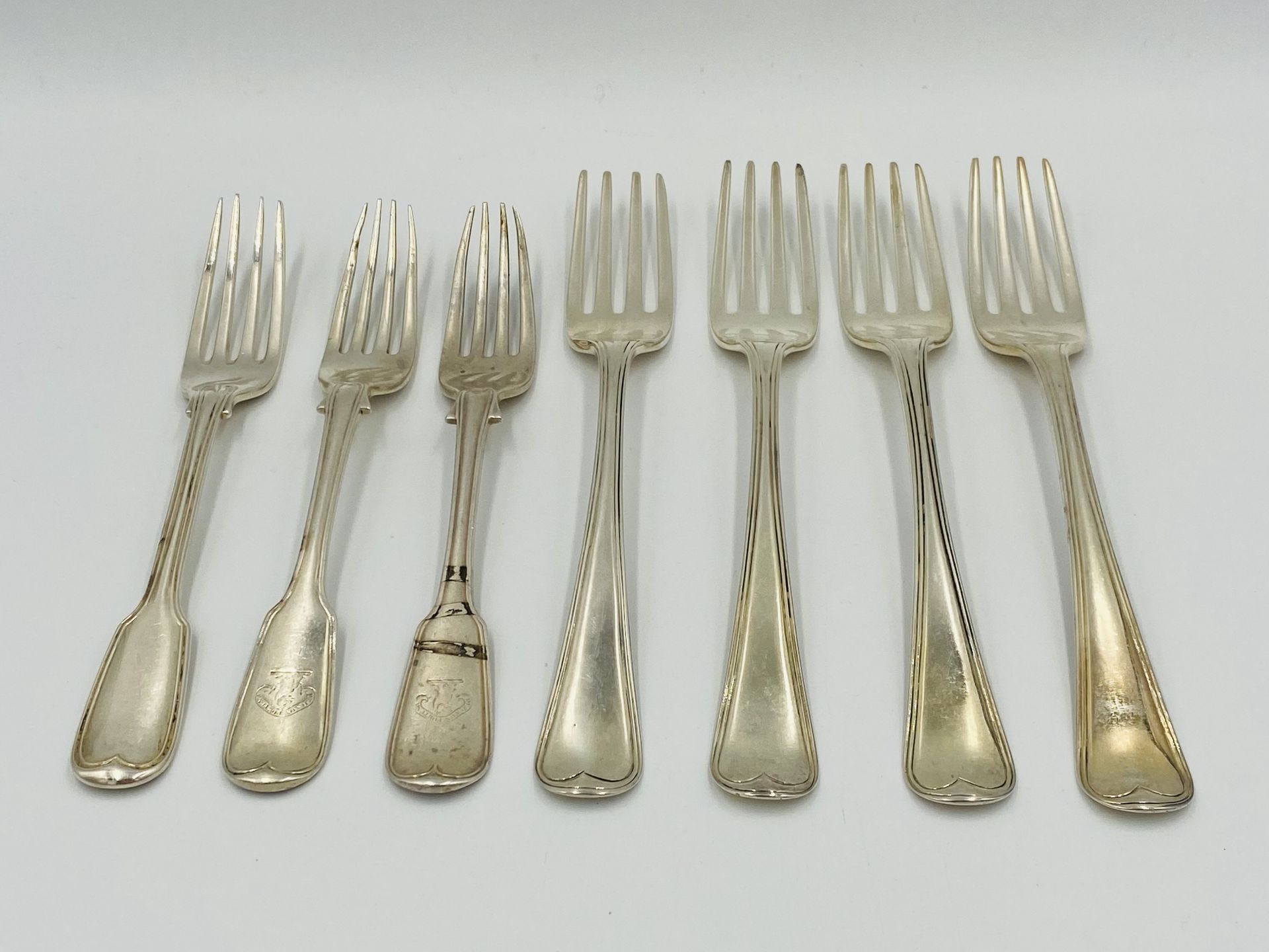 Four silver forks, 1815; together with four silver forks, 1839