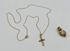 9ct gold necklace with 9ct gold pendant cross, set with a sapphire; together with a 9ct gold charm