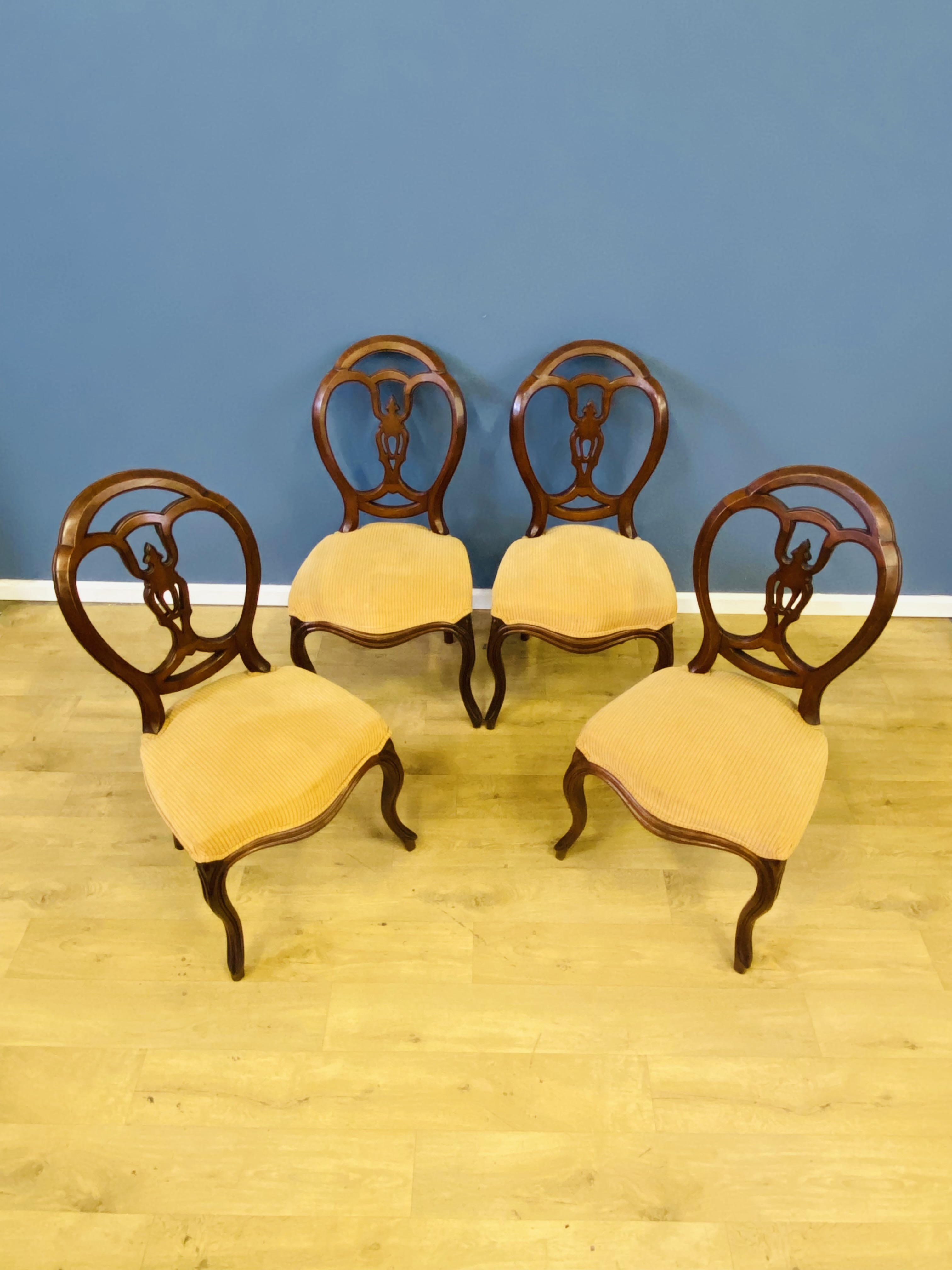 Four walnut balloon back chairs