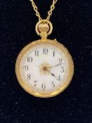 Ladies fob watch with enamel face marked 18ct on yellow metal chain