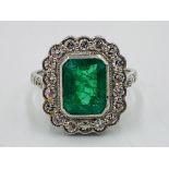 18ct white gold, emerald and diamond ring