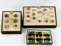 24 silver rings in display cases; together with a box of cufflinks