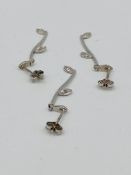 Three 9ct white gold earrings