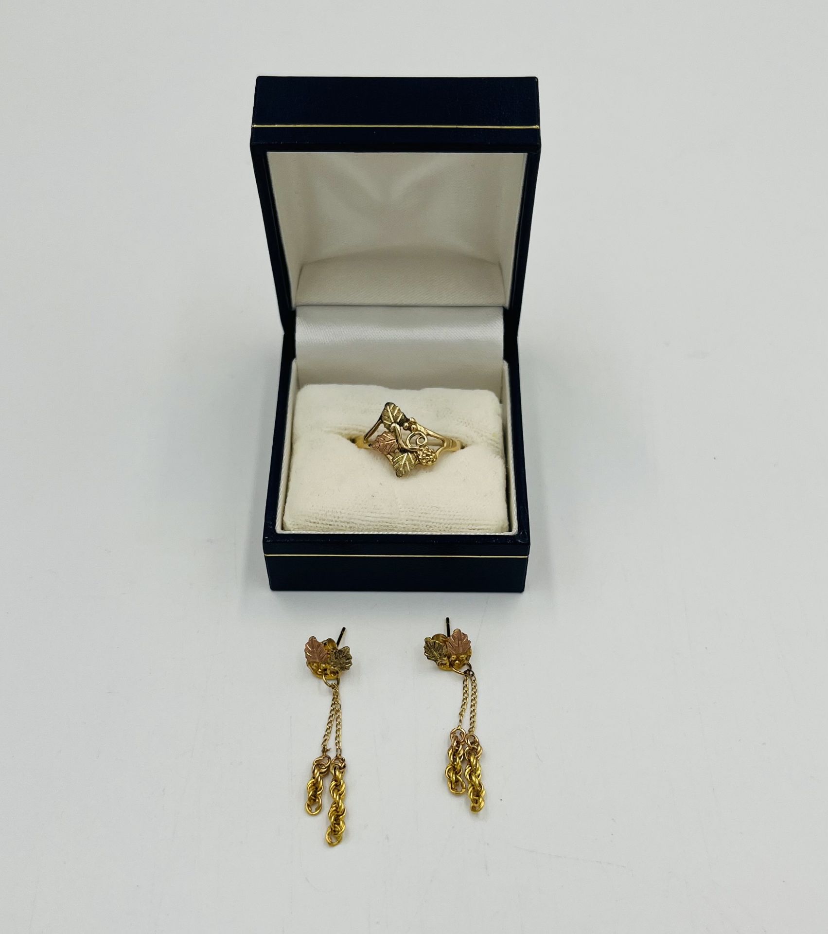 10ct gold ring together with a matching pair of 10ct gold earrings