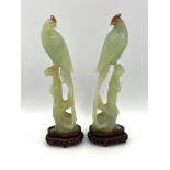Pair of early 20th century chinese carved jade birds resting on tree stumps