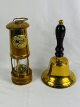 Brass miners lamp together with a brass hand bell