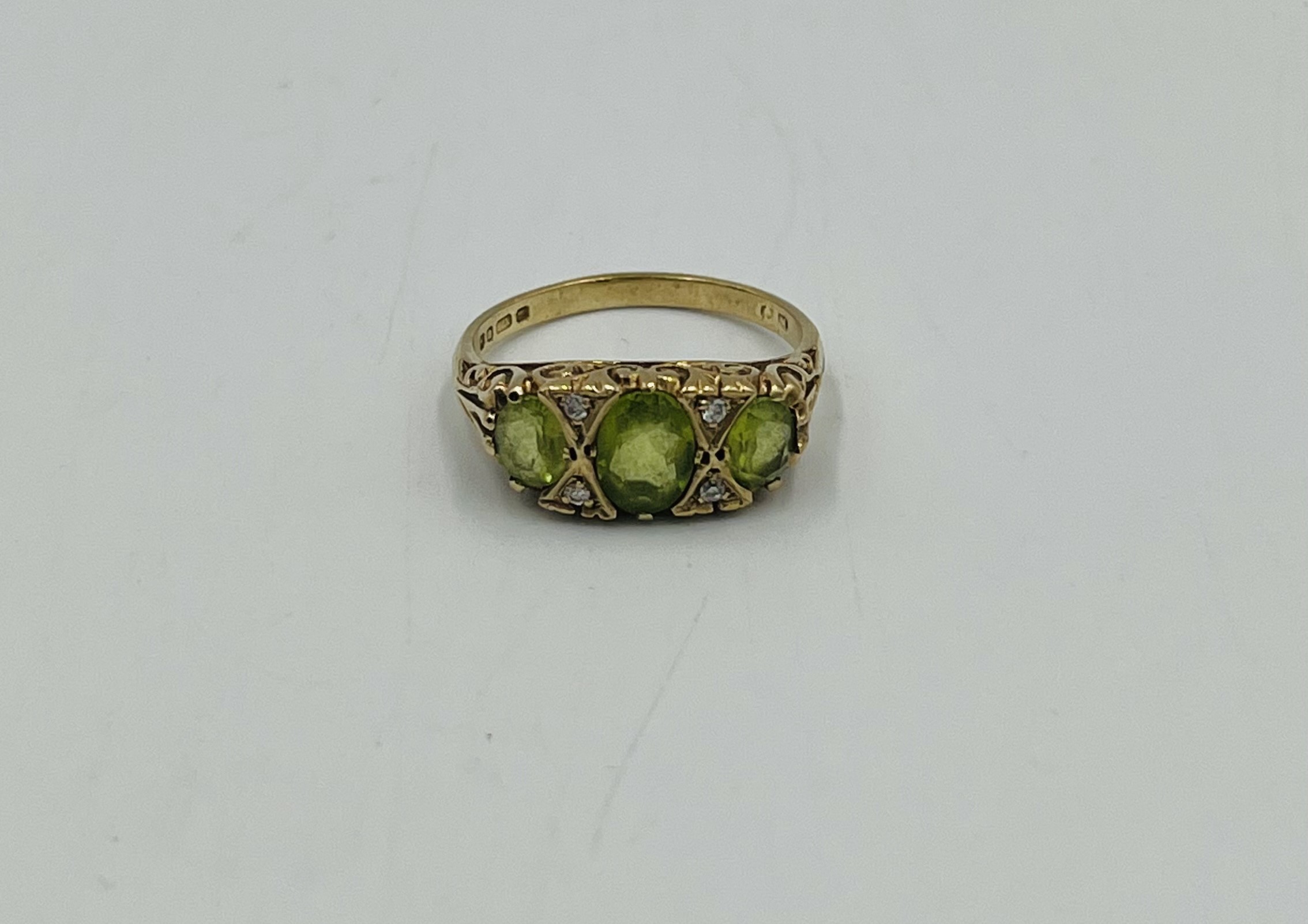 9ct gold ring set with a green stone