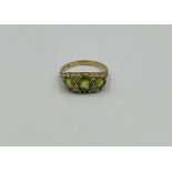 9ct gold ring set with a green stone