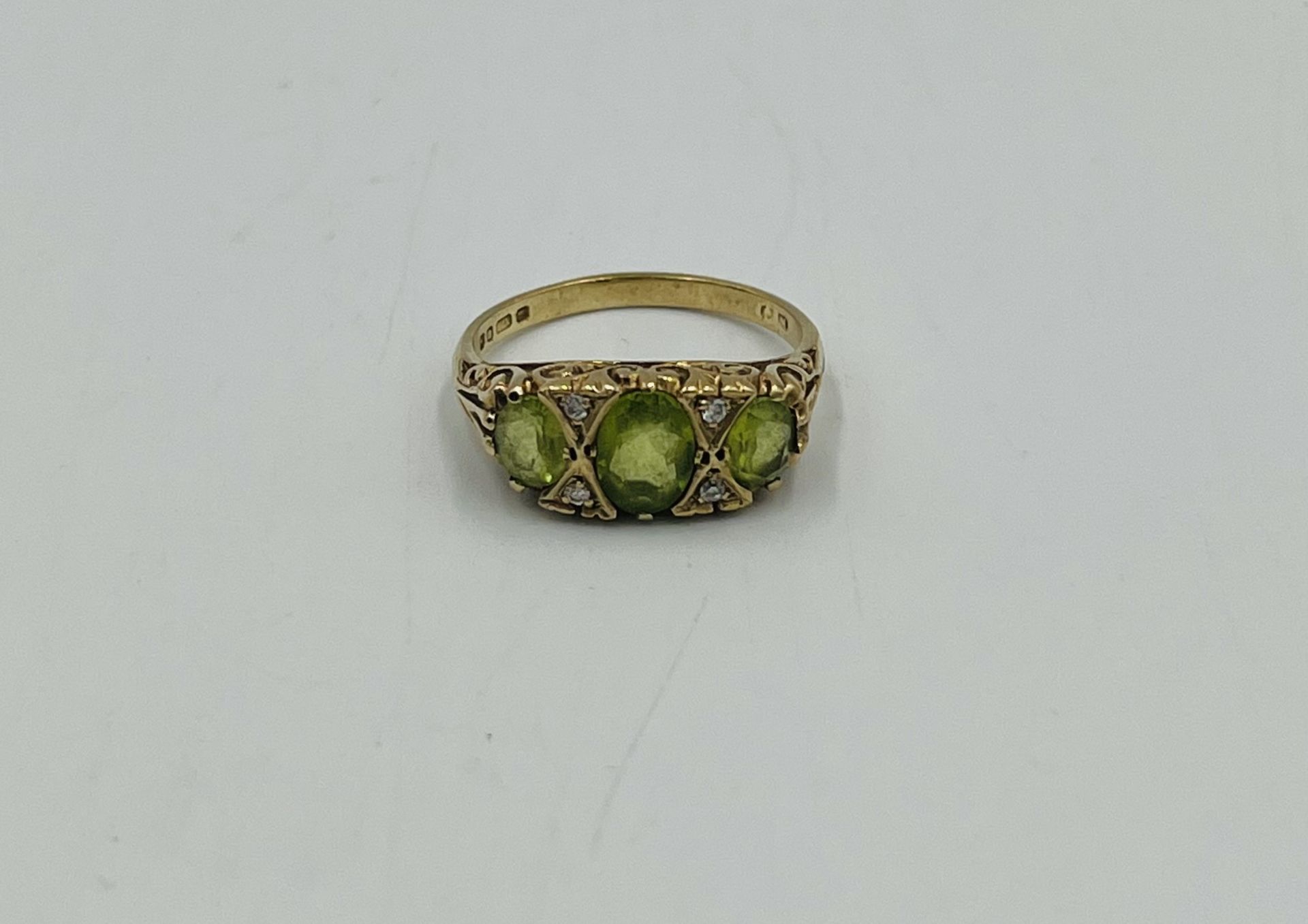 9ct gold ring set with a green stone