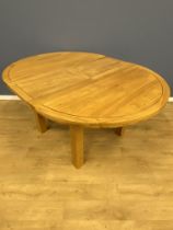 Oak circular dining table with leaf extension