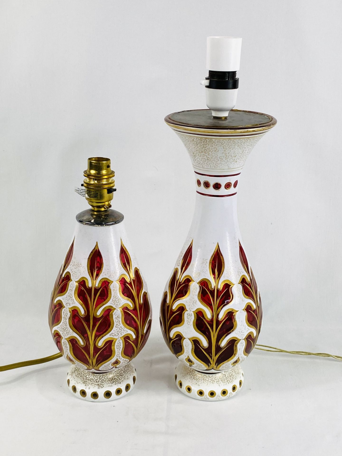 Opaque and ruby glass table lamp; together with a similar lamp