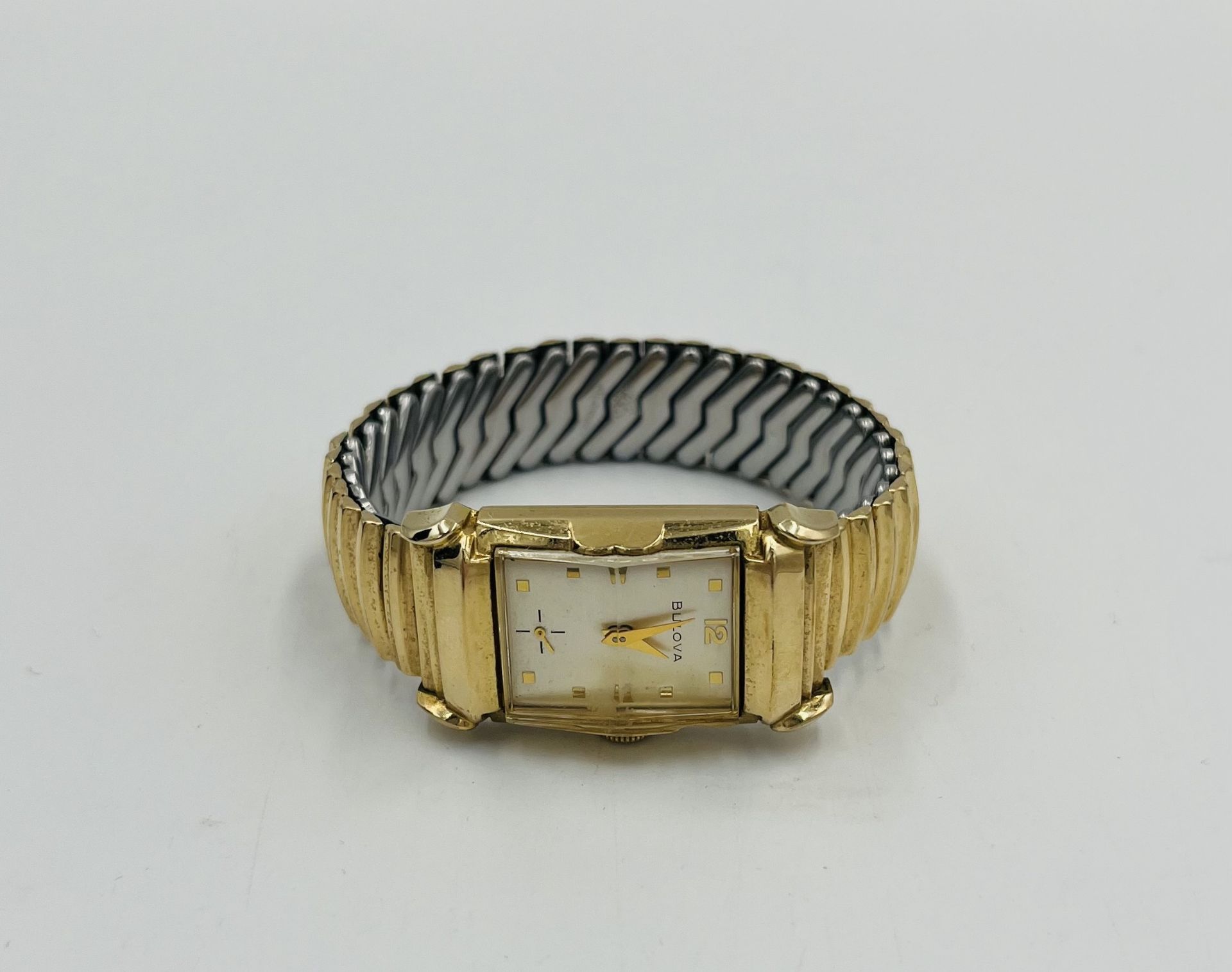 Bulova "tank" style 10k rolled gold cased manual wind wrist watch