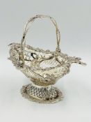 A pair of silver cruet bowls together with a silver filigree bonbon dish