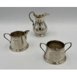 A silver milk jug and bowl, together with a silver milk jug