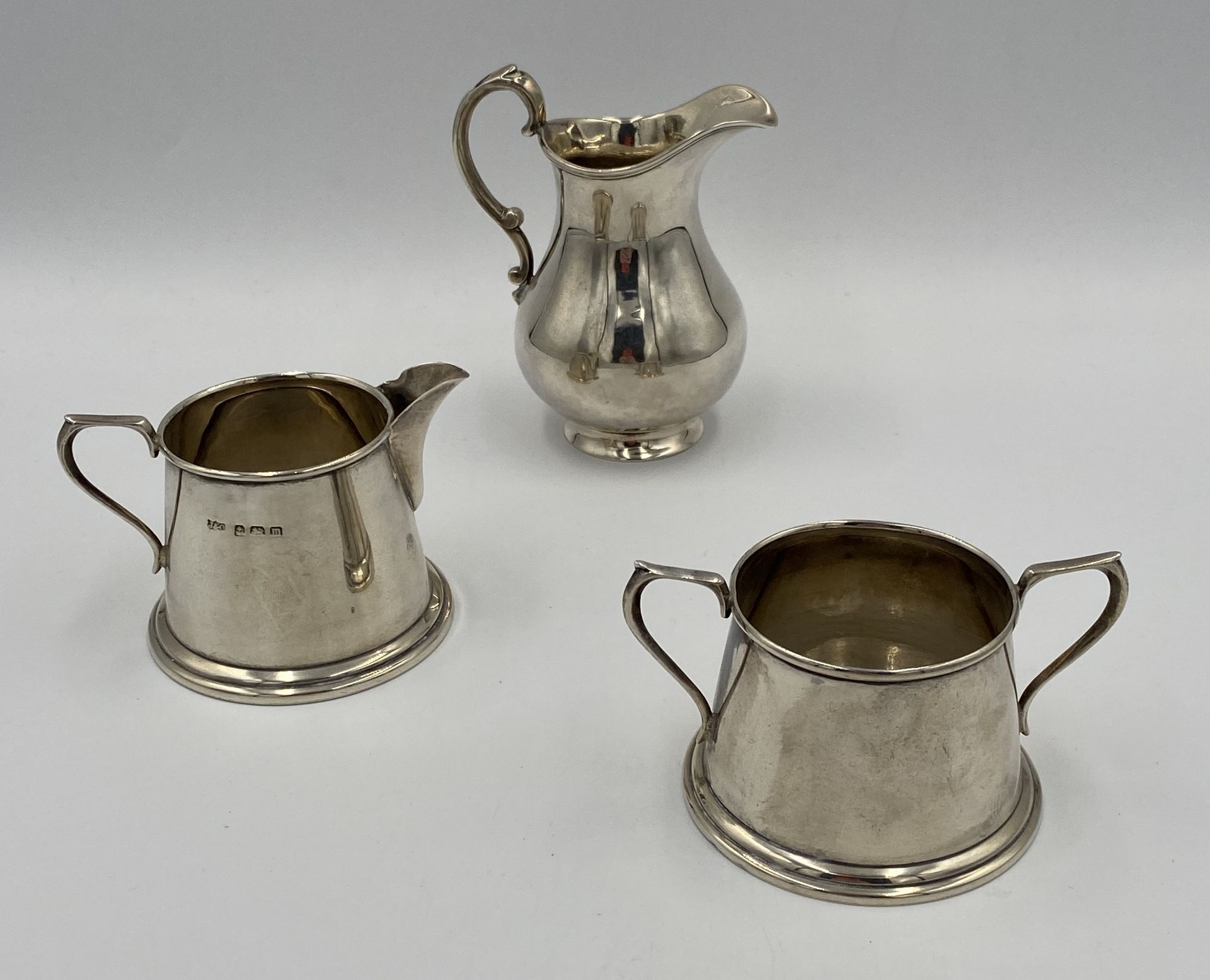 A silver milk jug and bowl, together with a silver milk jug