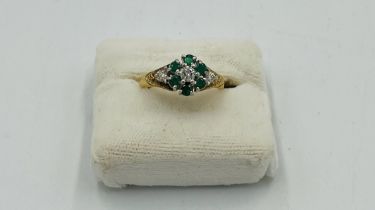 18ct gold ring set with diamonds and emeralds