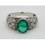 18ct white gold, diamond and emerald ring