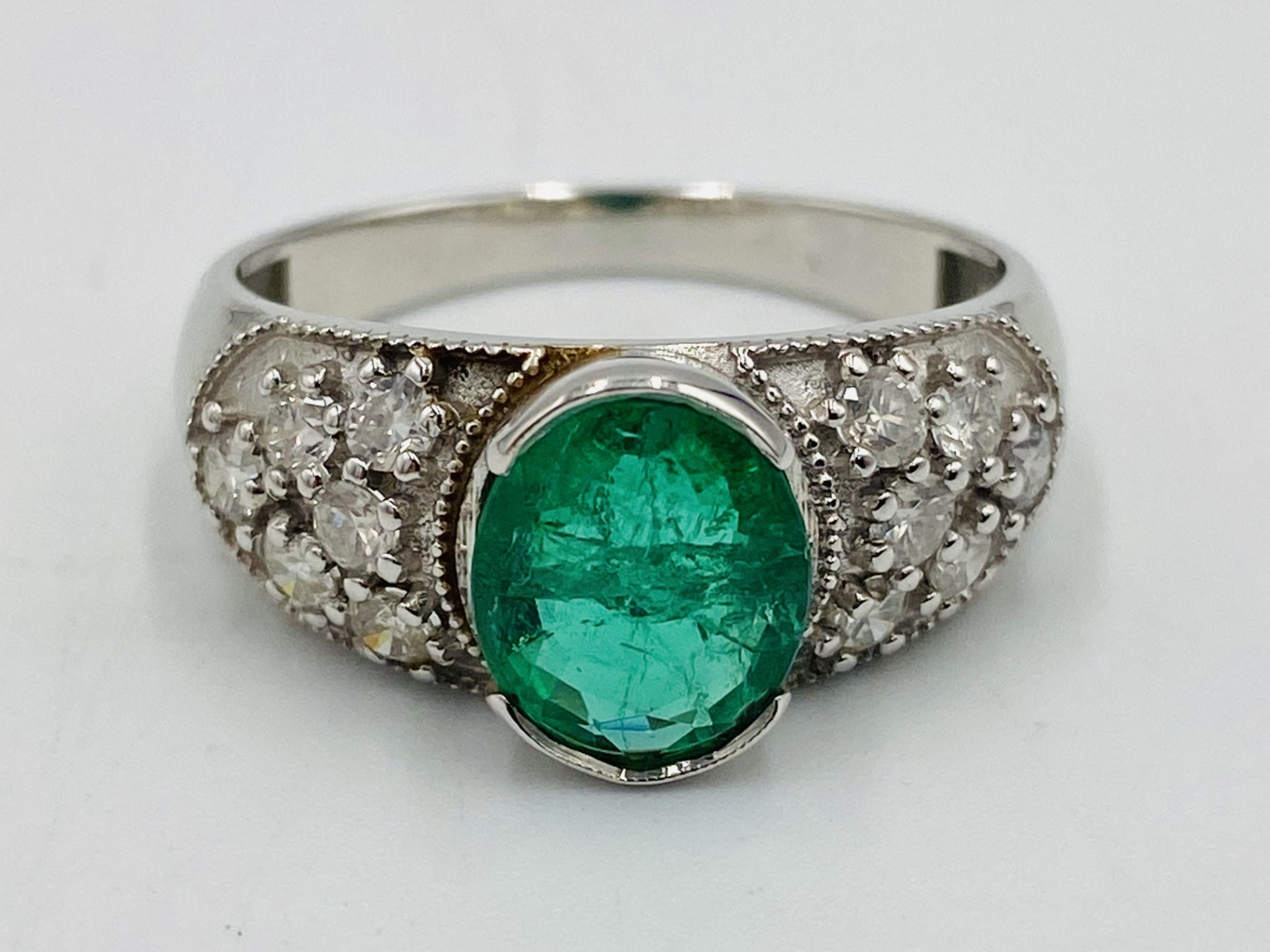 18ct white gold, diamond and emerald ring