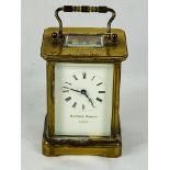 Matthew Norman brass cased carriage clock with bevel edged glass engraved to top,