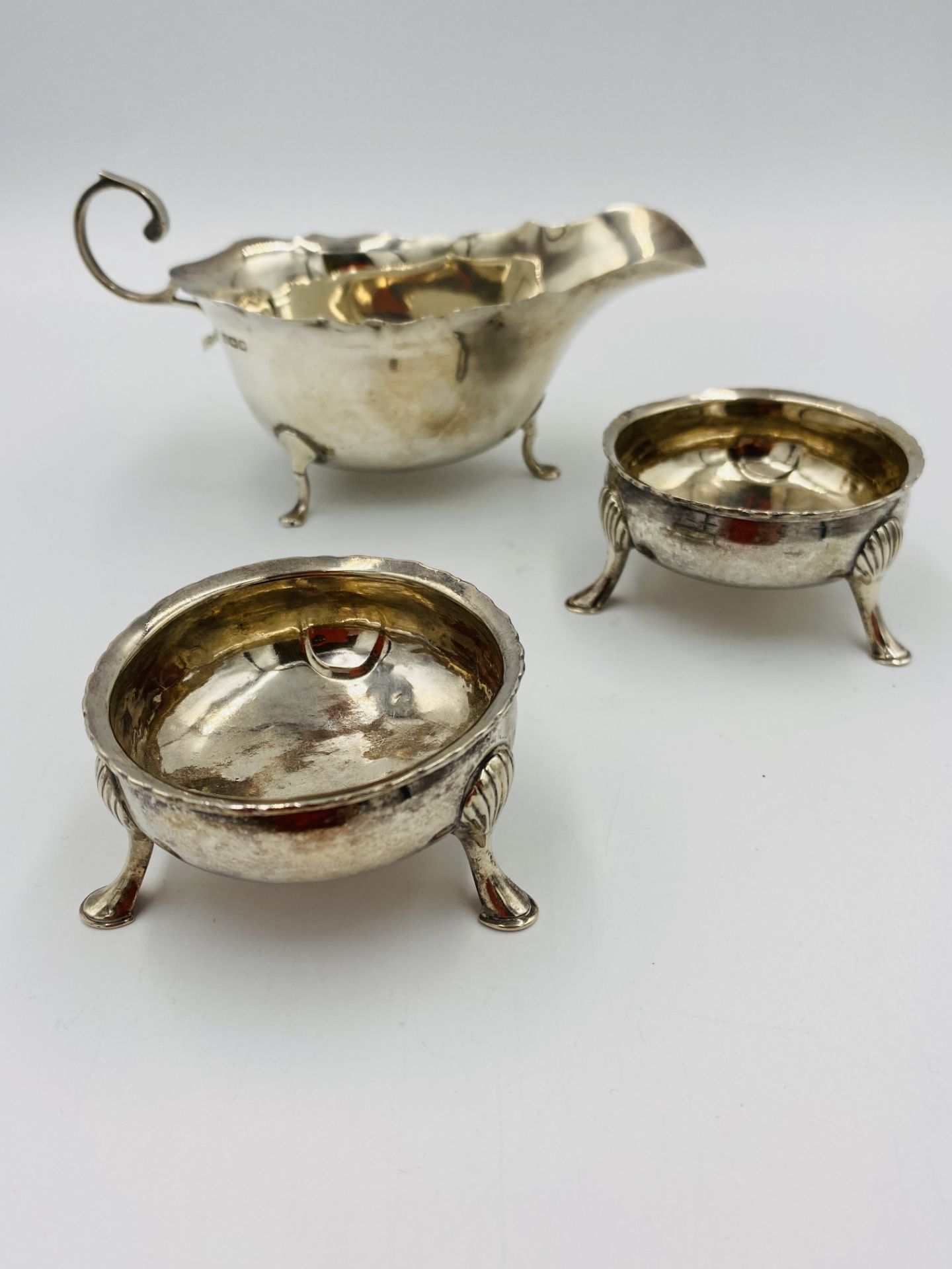 Silver sauce boat with two silver salts