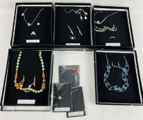 Five silver necklace and earring sets; together with three silver necklaces