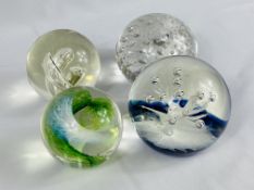 Two Selkirk glass paperweights together with two other glass paperweights