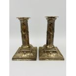 Pair of filled silver candlesticks