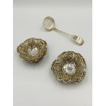 Two silver bon bon dishes and a silver sifter ladle