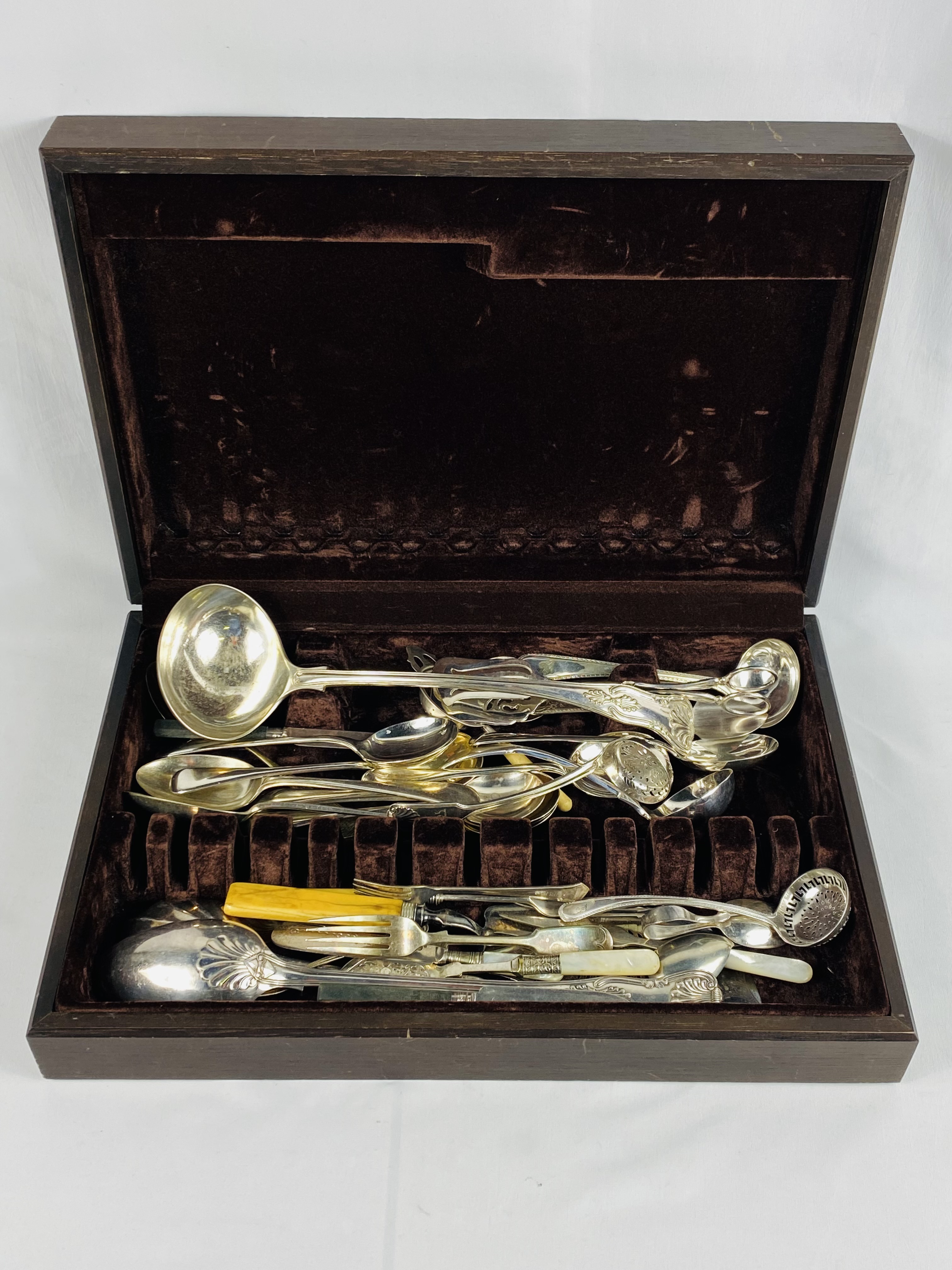 Wooden cutlery box containing a quantity of silver plate spoons and other cutery