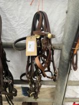 Three brown leather young hunter in-hand showing bridles and one brown leather pony working bridle