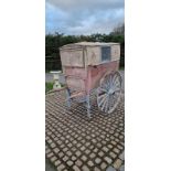 BAKER'S HAND CART, on two iron tyred wheels, featuring painted ironwork in light blue.