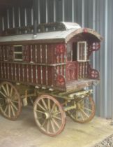 CHILD'S READING WAGON painted red with cream-lined chamfers cream wheels