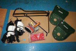 Assorted stable items including haynets, saddle rack and a grooming kit