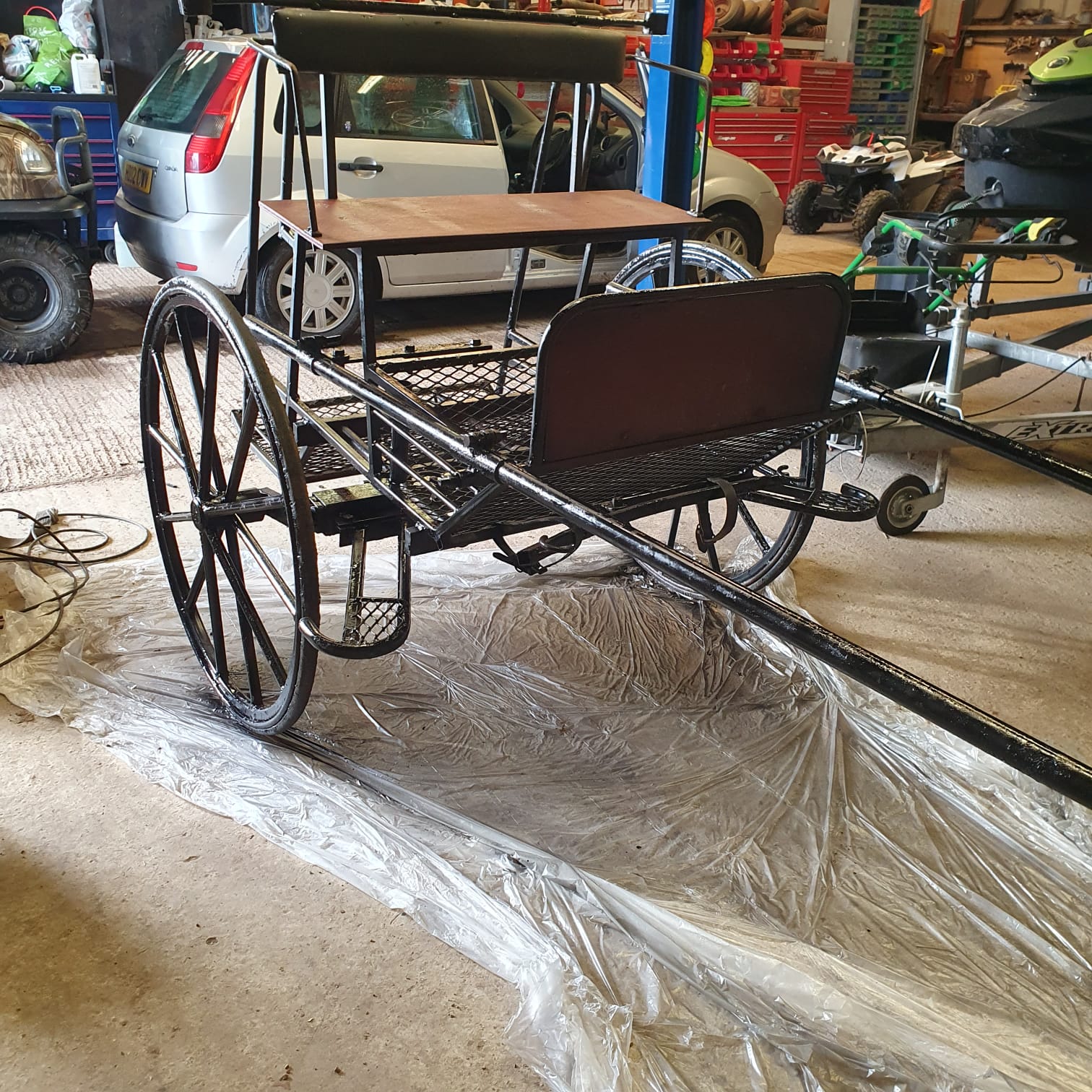 MARATHON CART, 2-wheeled with rubber tyres, painted black.