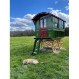 BURTON SHOWMAN'S WAGON finished in a traditional bottle green colour with a burgundy door.