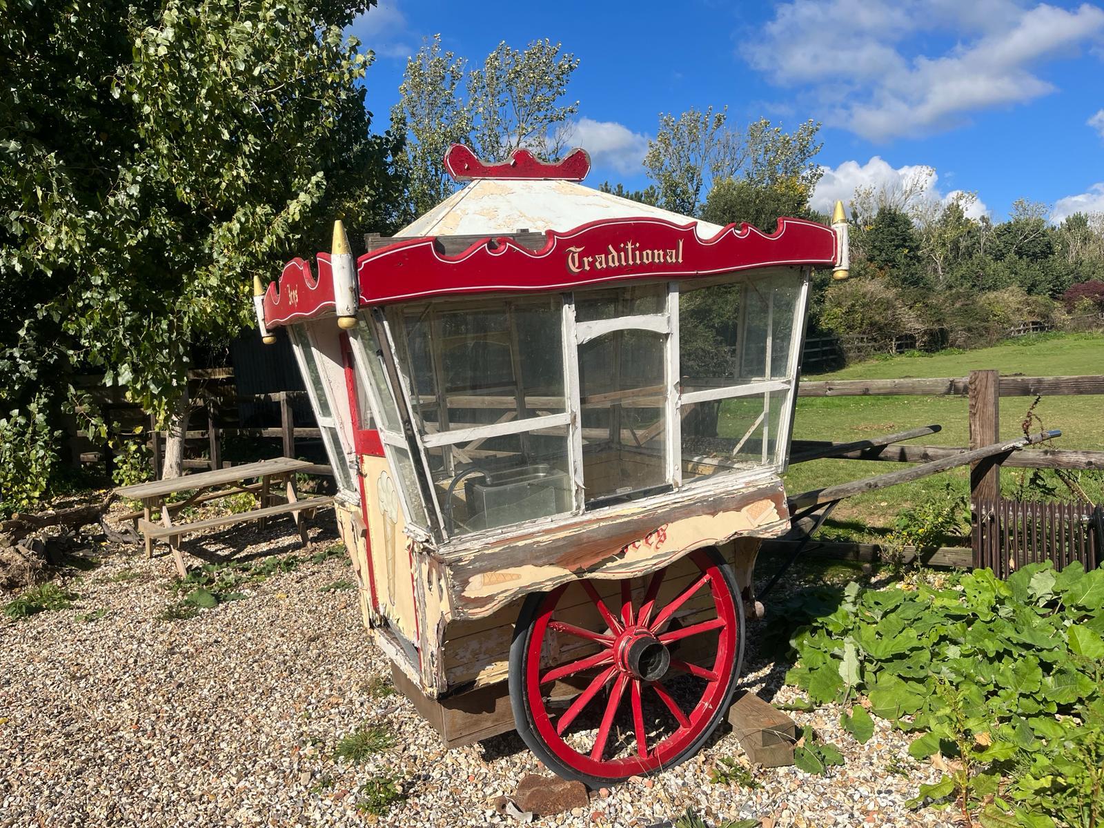 ICE CREAM VAN, a two-wheeled vehicle with rubber tyred wheels painted red.