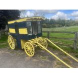 AMERICAN BUTCHER'S SHOP, a 4-wheeled enclosed van painted dark blue and yellow on iron tyres.