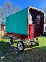 SQUARE BOW TOP with green canvas roof, the under body painted maroon with gold and cream detailing.