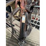 Four 4" stirrup leathers and irons and an anti cast roller